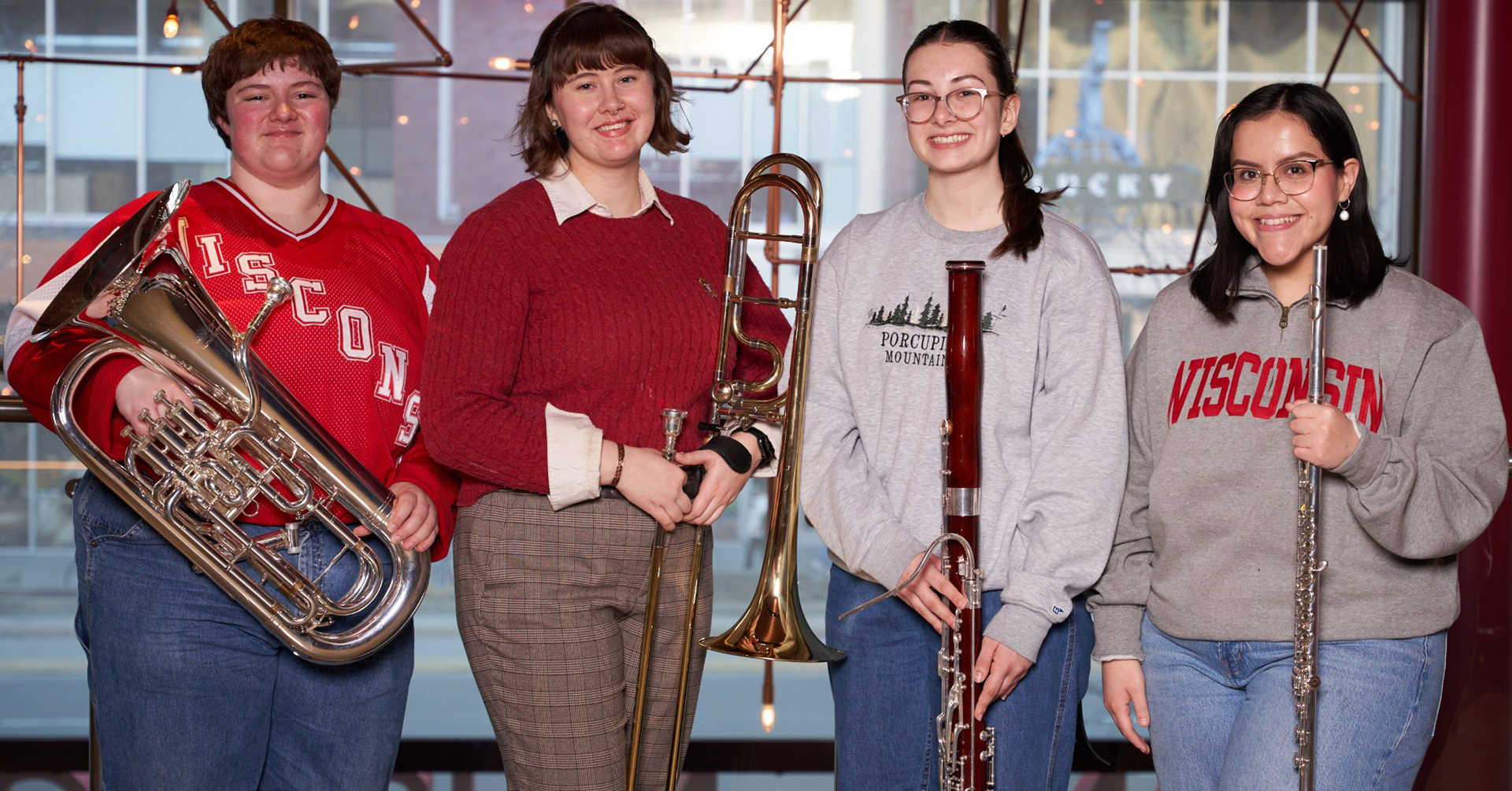 Pictured left to right with instruments, Polaris Buttles, euphonium, Sofia Stutesman, trombone, Morgan Musil, bassoon, and Isla Coronado, flute, who were selected to participate in the in the 2026 CBDNA North Central Division Intercollegiate Band. 
