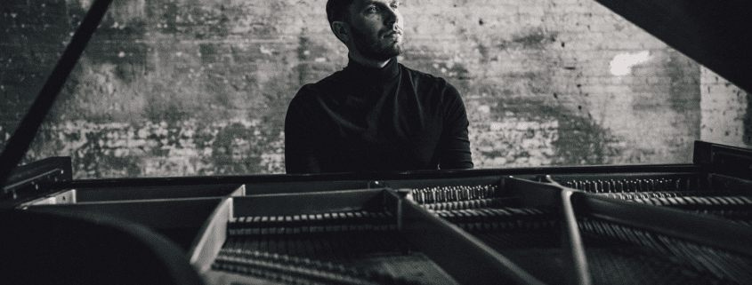 A photo of Boris Krivoshein at a piano.