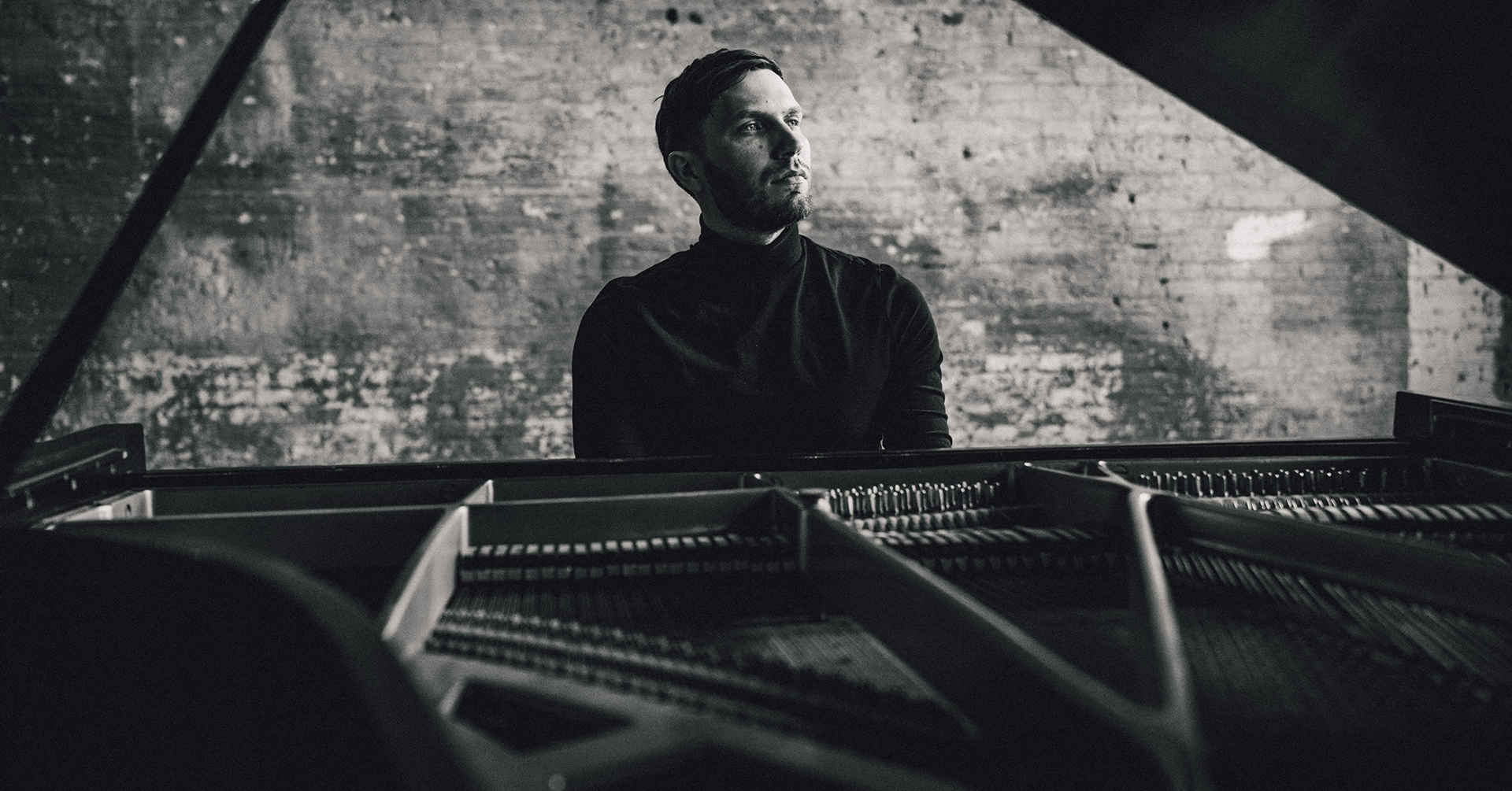 A photo of Boris Krivoshein at a piano.