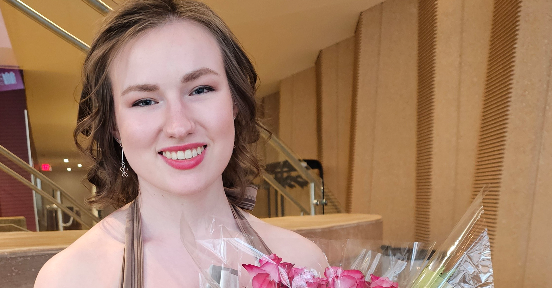 A photo of Haley Street holding flowers.