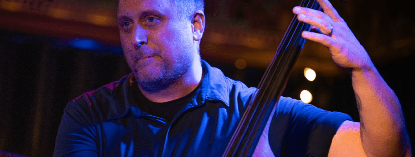 A photo of Jeff Weiss playing double bass.