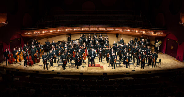A photo of the University Symphony Orchestra on stage at the Hamel Music Center.
