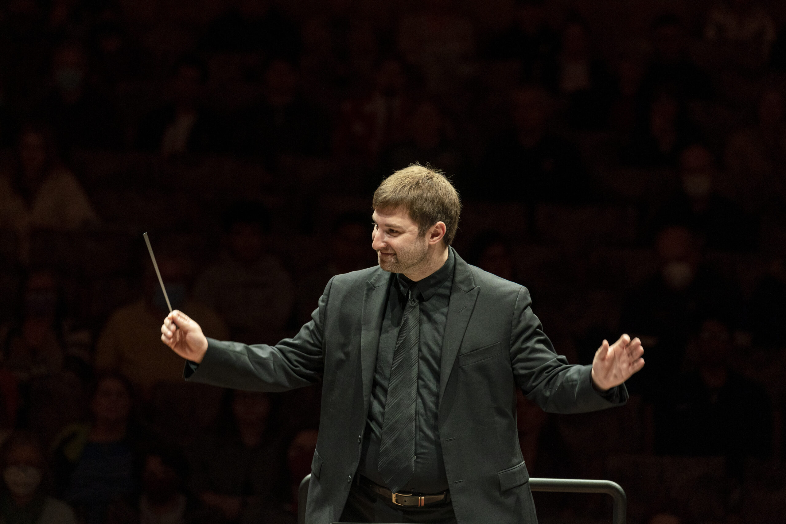 A photo of a student conducting.