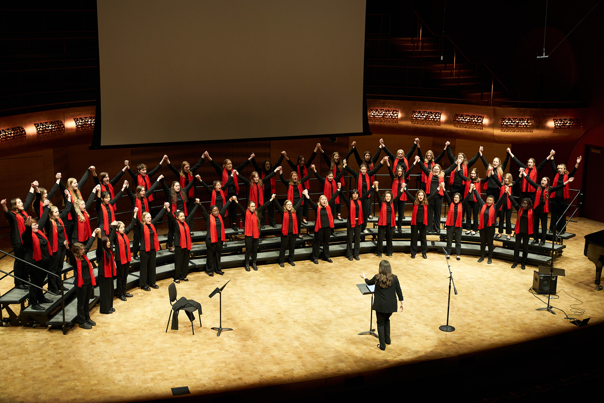 An image of Treble Choir performing on stage at the Hamel Music Center.
