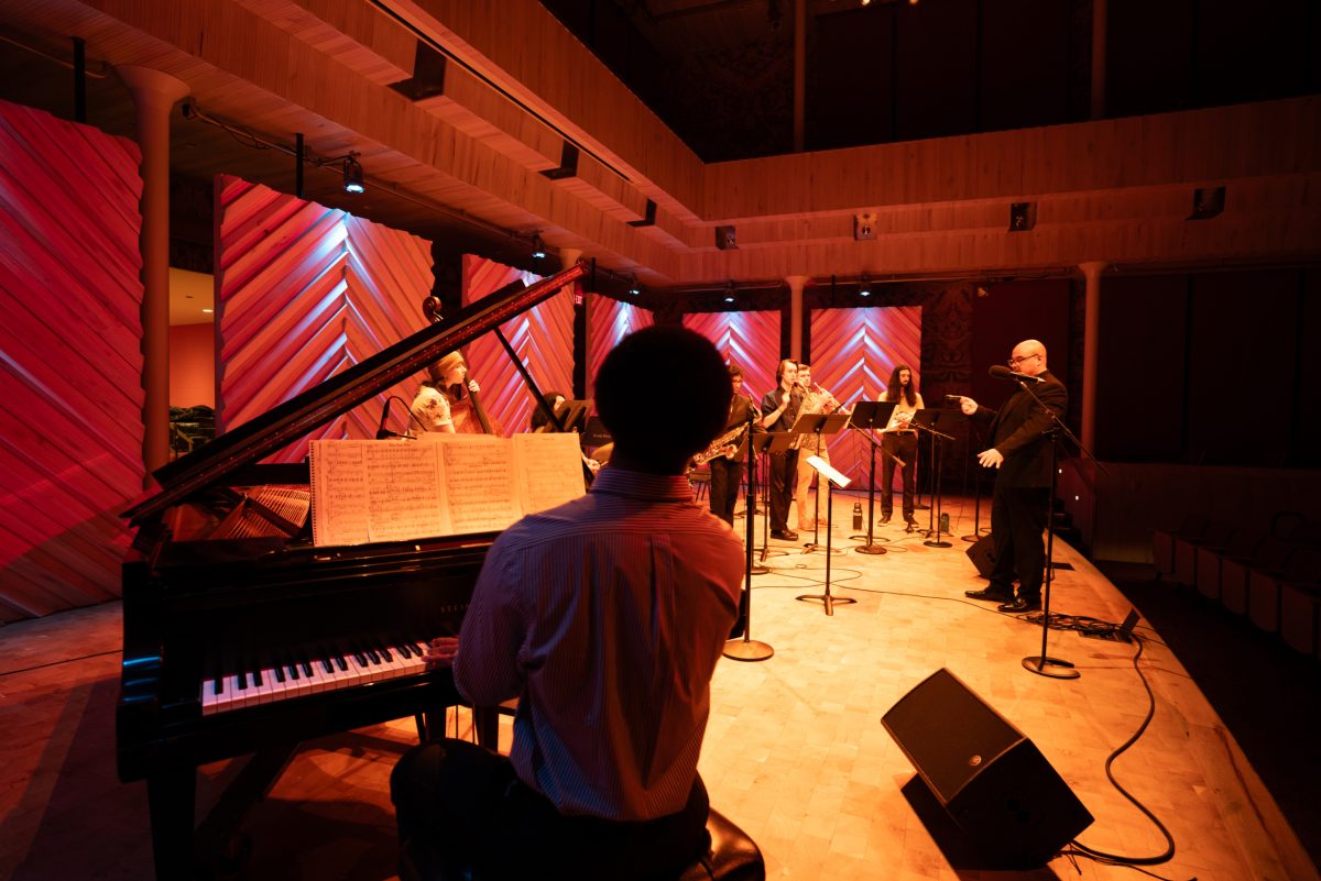 A photo of Afro-Cuban Jazz Ensemble on stage in Collins Recital Hall at the Hamel Music Center.