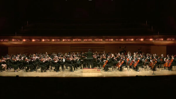 A photo of All- University String Orchestra performing on stage at the Hamel Music Center.