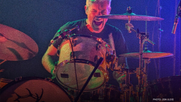 A photo of drummer Marty Beller performing on stage.