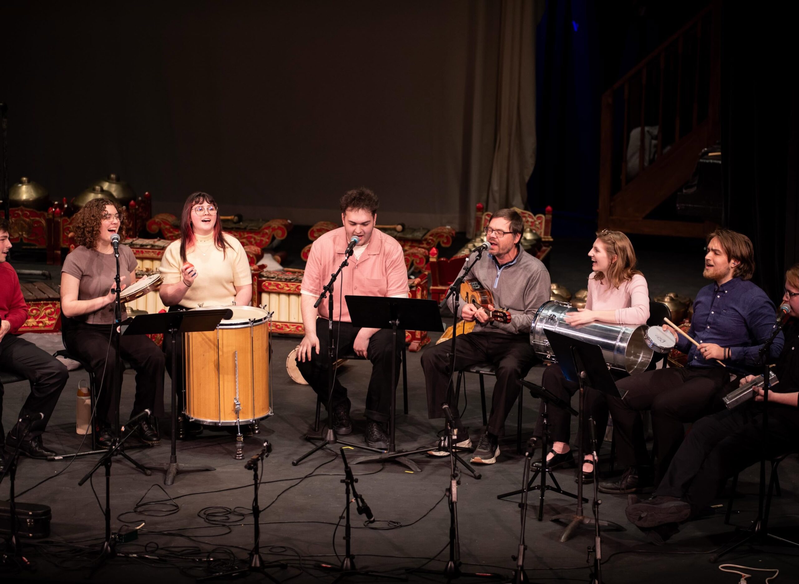 A photo of a percussion ensemble performing on stage.