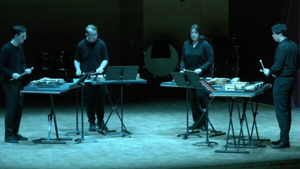 A photo of the Chamber Percussion Ensemble performing on stage in the Mead Witter Foundation Concert Hall at the Hamel Music Center.